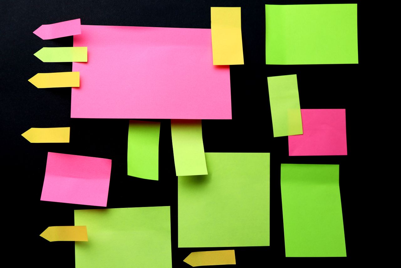 Mastering the First Impression: Your intriguing post title goes here Bright pink, yellow, and green sticky notes arranged geometrically on a black background.