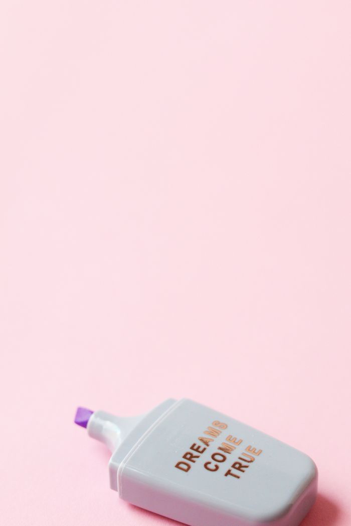The Art of Drawing Readers In: Your attractive post title goes here Close-up of a highlighter on a pink background with 'Dreams Come True' text.